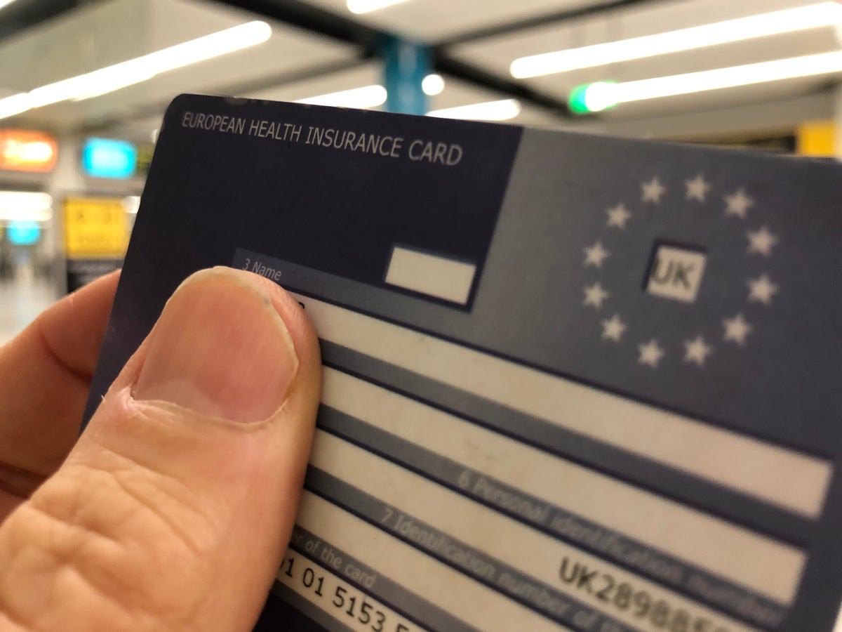 Hand holding a European Health Insurance Card